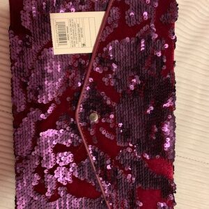 Women purple sequin clutch